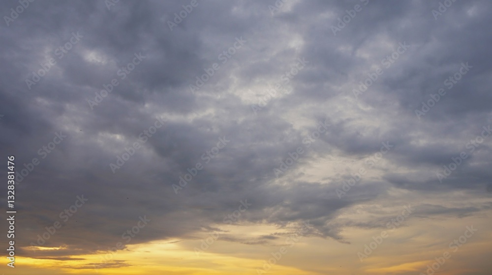 Fototapeta premium evening sky, bright afternoon sky with dark clouds and highlighted by yellow sunlight