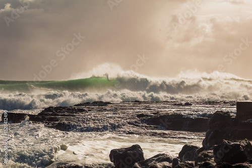 Tableau sur toile A moody, atmospheric photo of heavy surf and crashing breakers driven by an approaching cyclone or hurricane at Snapper Rocks on the Gold Coast on the East coast of Queensland, Australia