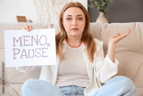 Upset mature woman holding ...