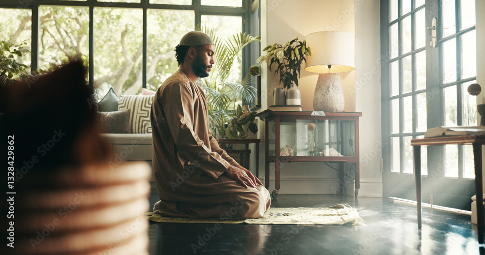Fototapeta premium Islam, prayer and religion with man in home for ramadan kareem, spiritual and worship. Floor, faith and eid Mubarak with Muslim person and salah in living room for holy month, Allah praise and dua