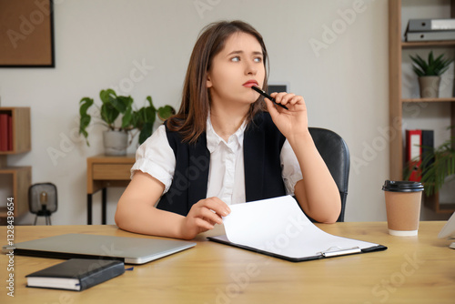 Thoughtful businesswoman wi...
