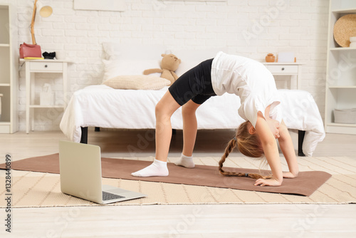 Cute little girl with mat a...