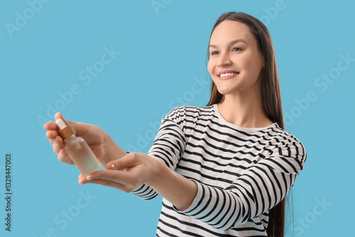 Young woman with bottle of ...