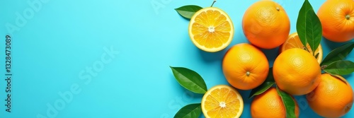 Fresh oranges arranged on bright blue background, juicy, vitamin C, colorful