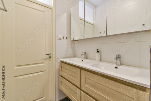 Wallpaper Mural A sleek and contemporary bathroom showcasing elegant fixtures and ample storage space. The design combines functionality with modern aesthetics, creating a serene atmosphere. Torontodigital.ca