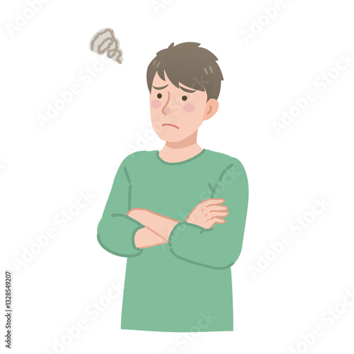 斜め上を見上げて腕組みをする男性
