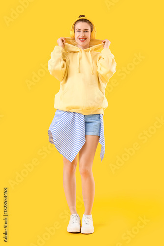 Stylish young woman in hood...