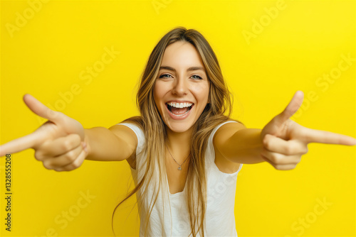 A joyful portrait of a woman with an infectious smile, captured against a bright yellow background, expressing pure happiness and spontaneous delight. photo