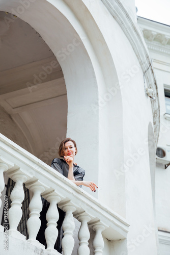 Beautiful woman 40 years old walking fashionably down the street photo