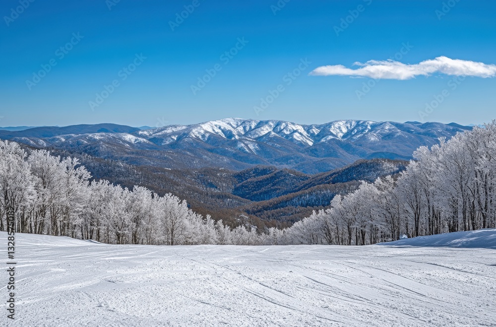 Breathtaking Winter Landscape Featuring Snow-Covered Mountains Under Clear Blue Sky with Frosted Trees and Scenic Snowy Slopes in The Background Breathtaking Winter Landscape Featuring Snow-Covered Mountains Under Clear Blue Sky with Frosted Trees and Scenic Snowy Slopes in The Background