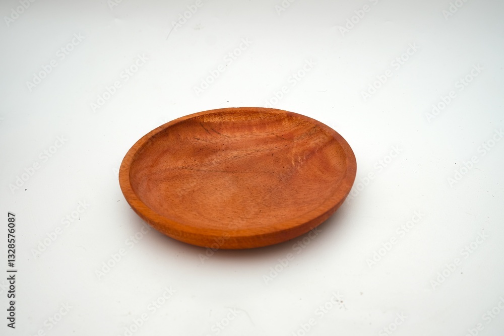 Simple yet elegant wooden plate on a clean white background, highlighting minimalist and sustainable design. Simple yet elegant wooden plate on a clean white background, highlighting minimalist and sustainable design.