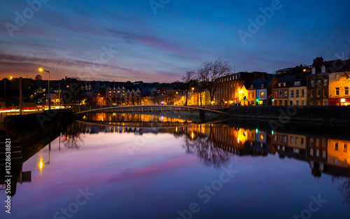 Cork, Ireland  - March 6th 2025 - sunset view of buildings along the River Lee