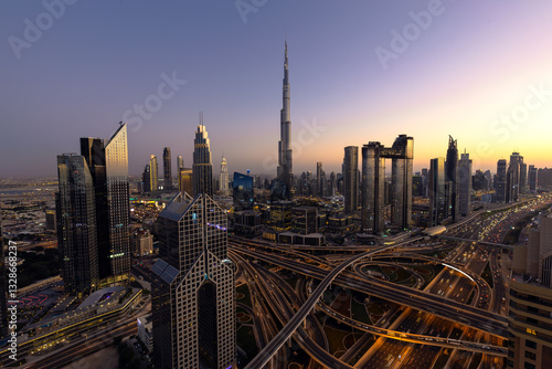 Modern city skyline and cityscape at sunset in Dubai UAE.