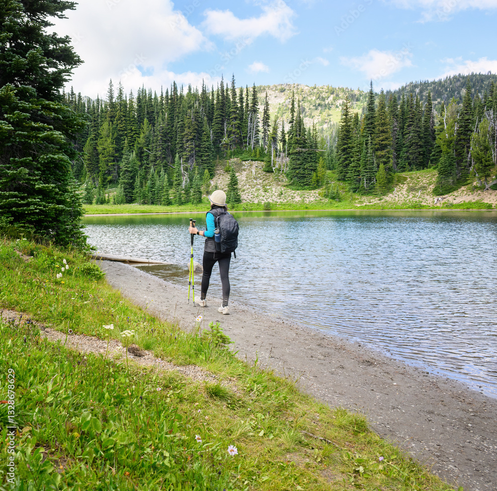 Woman hiking Shadow Lake Trail. Mount Rainier National Park. Washington State.