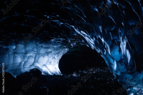 Dark blue and black naturally formed  ice cave with heart shaped bubbles in Vatnajokull Glacier National Park in Iceland