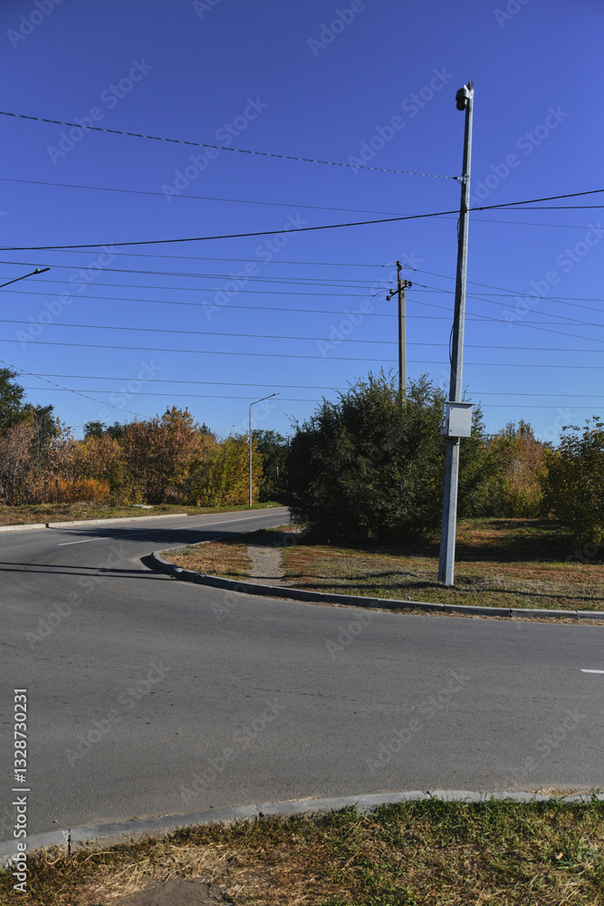 Autumn landscape of a small town. Village houses and roads covered with orange foliage Autumn landscape of a small town. Village houses and roads covered with orange foliage