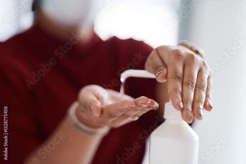 Person, hands and bottle in office with sanitizer, disinfectant and compliance for virus prevention. Business woman, liquid and spray in workplace for sterilizer, safety or hygienic practice