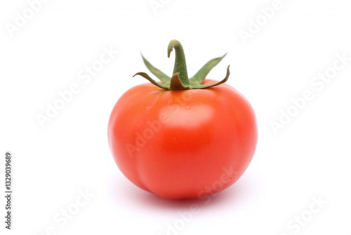 Wallpaper Mural single tomato on white surface with water droplets Torontodigital.ca