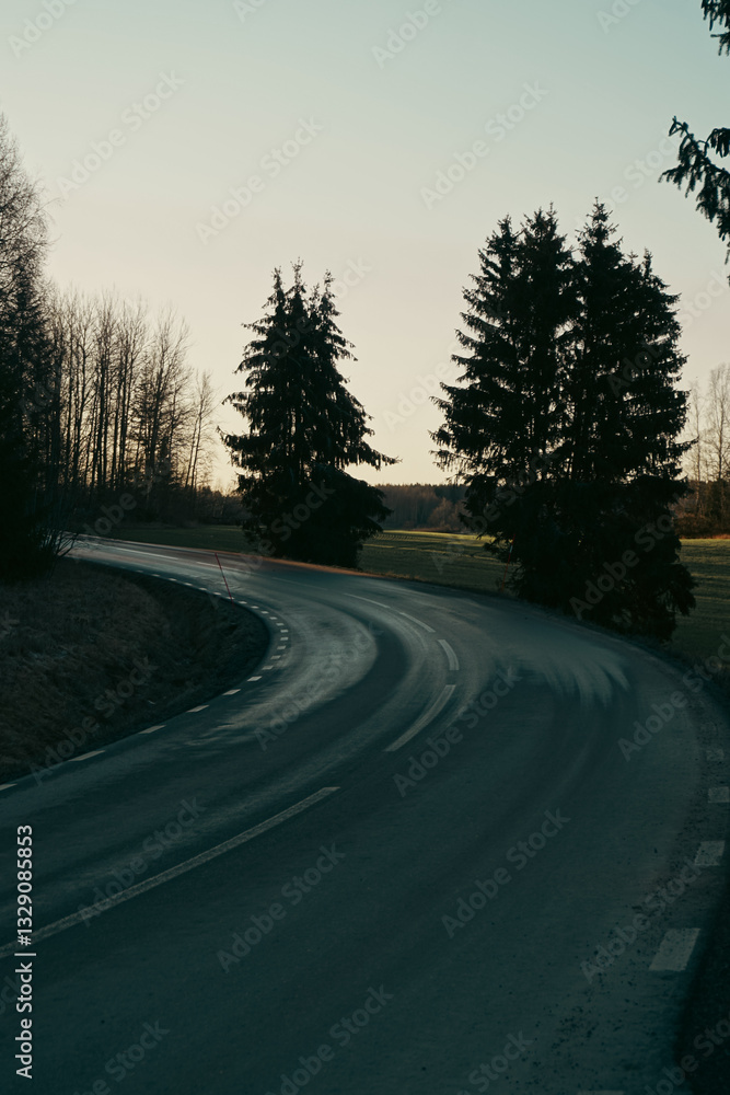Fototapeta premium A road curve during evening hours