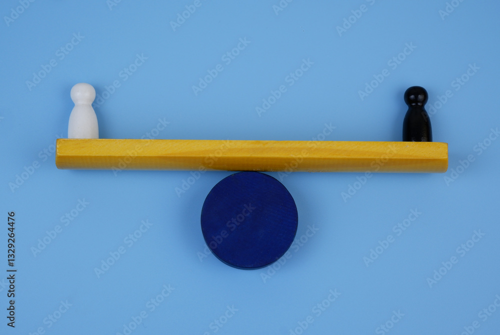 White and black figure of people balance on scales. Equality of races concept. White and black figure of people balance on scales. Equality of races concept.