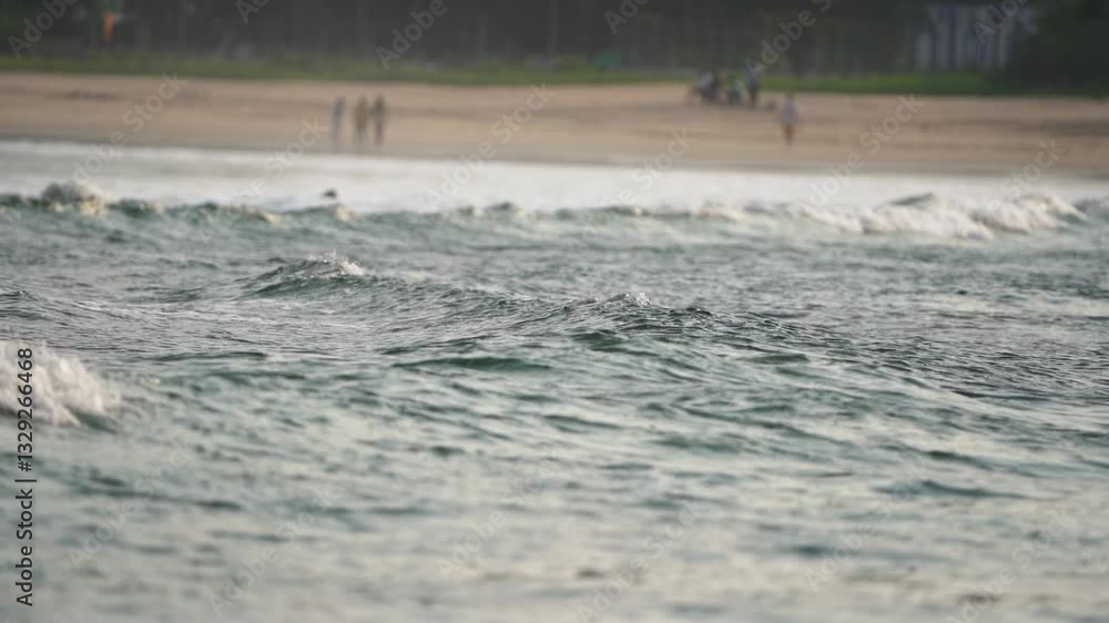 Ocean waves close-up, Coastal water ripples, Beach waves in motion, Scenic shoreline view, Tropical beach waves, Gentle sea tide, Blurred beach background stock video.
Ocean waves close-up, Coastal water ripples, Beach waves in motion, Scenic shoreline view, Tropical beach waves, Gentle sea tide, Blurred beach background stock video.