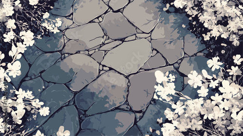 The image shows a high-angle, close-up view of a stone pathway.  The pathway is composed of irregularly shaped, grey and blue stones, creating a textured surface. White flowers are visible on