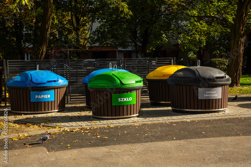 Obraz na plátne Colorful containers for garbage segregation in a large neighbourhood