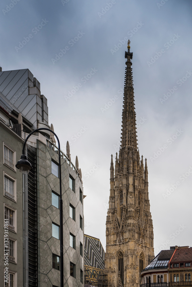 View of st Stephen Cathedral with gothic architecture and spires in the cityscape, Vienna, Austria. View of st Stephen Cathedral with gothic architecture and spires in the cityscape, Vienna, Austria.