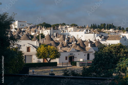 Alberobello, Italy - 22 September 2024: View of picturesque trulli rooftops in a historic village at sunset, Alberobello, Bari, Italy. photo