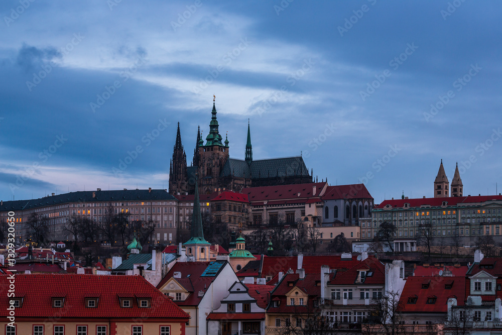 View of beautiful historic skyline with cathedral spires and rooftops at sunset, Prague, Czech Republic. View of beautiful historic skyline with cathedral spires and rooftops at sunset, Prague, Czech Republic.