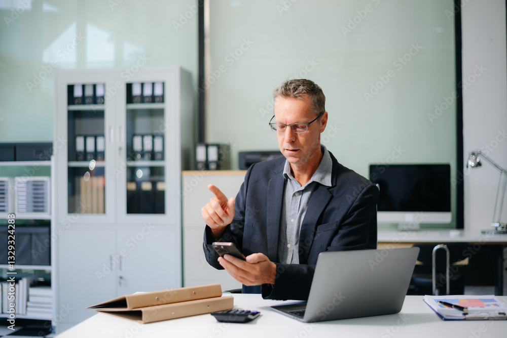 businessman in an office with a laptop, tablet, and notes. Ideal for business, finance, accounting businessman in an office with a laptop, tablet, and notes. Ideal for business, finance, accounting