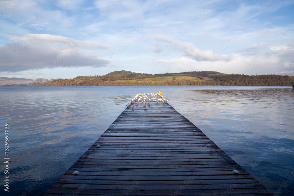 Fototapeta premium pier on the lake with clouds 