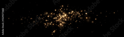 Golden glitter.Light effect.Glittering particles background. Gold dust on a transparent background.