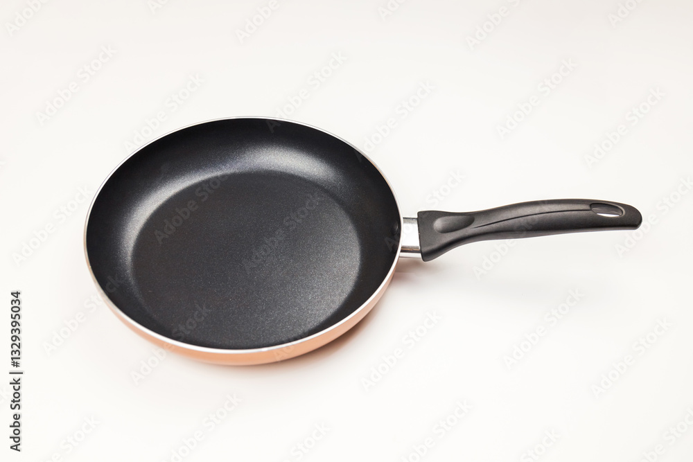 Cooking kitchenware frying pan on solid color background Cooking kitchenware frying pan on solid color background