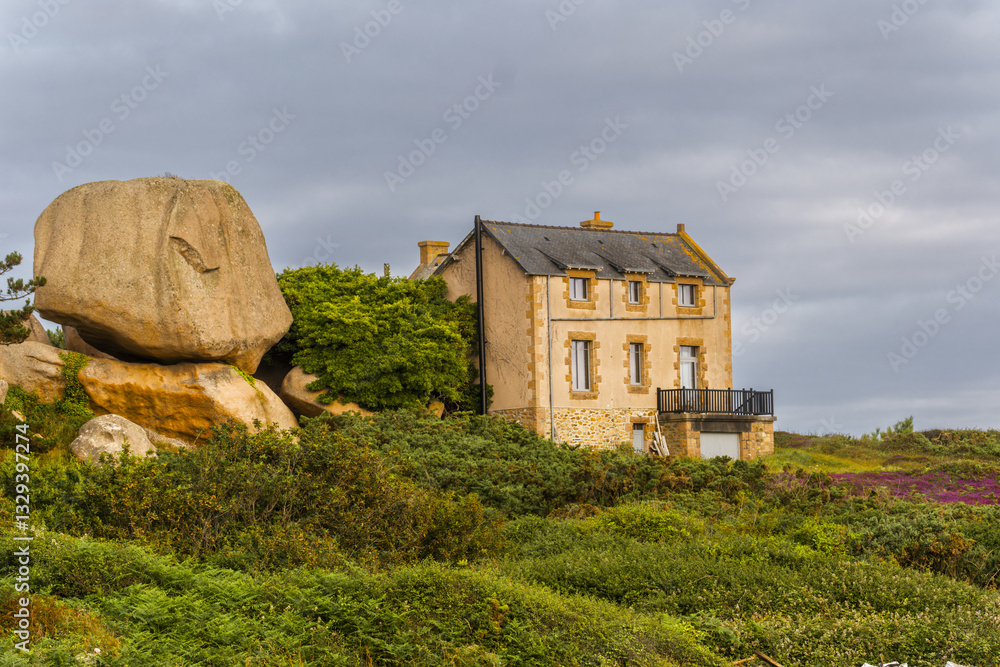 Obraz premium Maison du Littoral located on the cape of pink granite rock located in Perros-Guirec, Côtes-d'Armor, France,