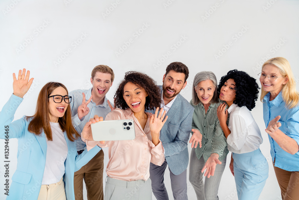 Diverse professional team taking a cheerful group selfie in a formal setting, multi-age Diverse professional team taking a cheerful group selfie in a formal setting, multi-age