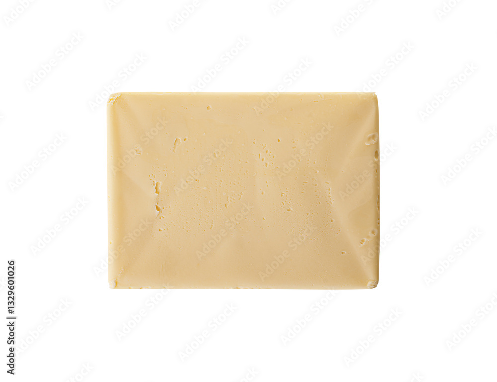 A rectangular block of fresh, creamy butter with a smooth texture and a pale yellow hue, isolated on a white background.
