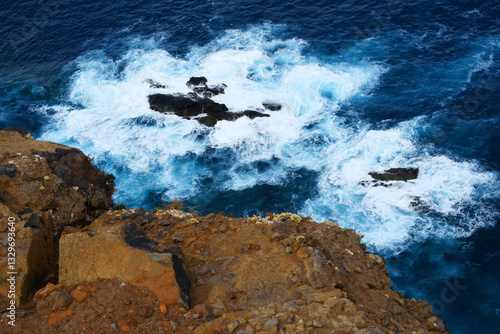 Obraz na płótnie foamy water of the Atlantic Ocean under the cliffs of the Ponta de São Lourenço (Madeira, Portugal) w salonie