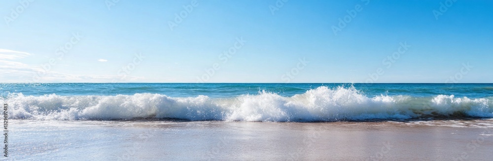 Crashing waves on sandy beach under clear blue sky. Crashing waves on sandy beach under clear blue sky.