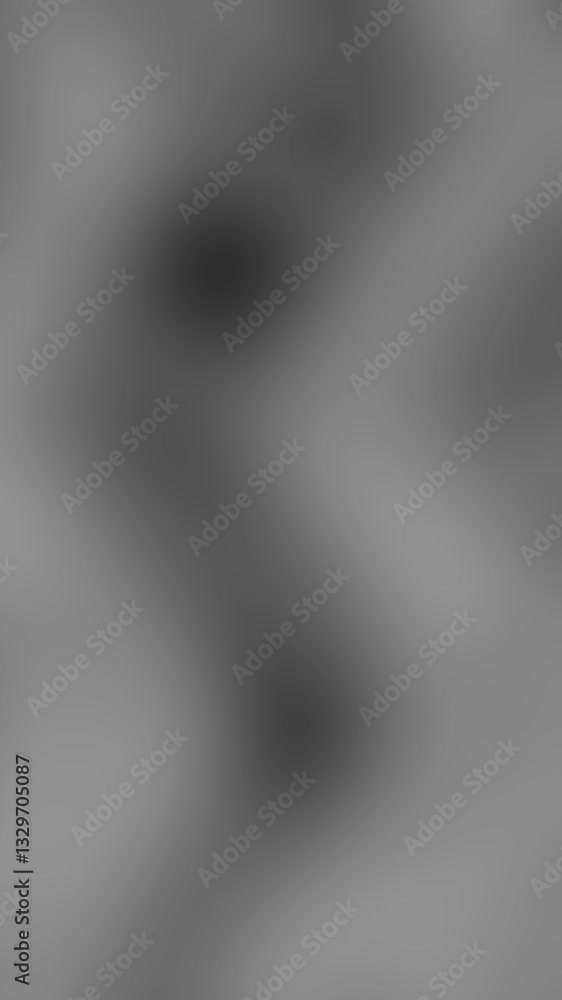 An abstract neutral black and white mottled grainy grunge texture motion graphic background loop design.