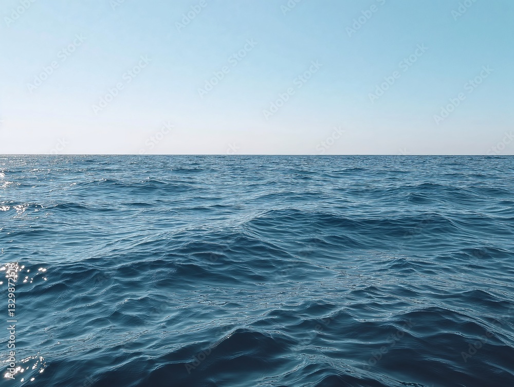 Fototapeta premium Bright blue ocean, endless horizon, calm water, and blue sky