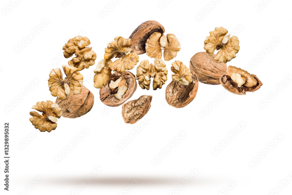 Shelled walnuts floating on white background. Shelled walnuts floating on white background.