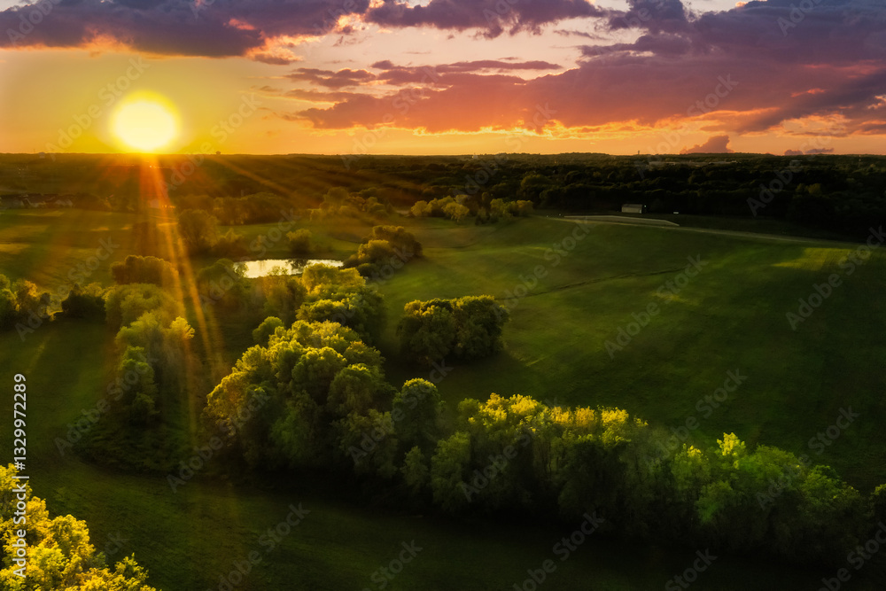 Sun Sets Over Fields and Trees