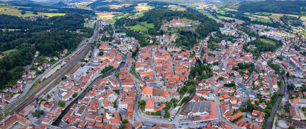 Aerial panoramic view around the old town of the city Kronach in Germany on a sunny afternoon in spring.