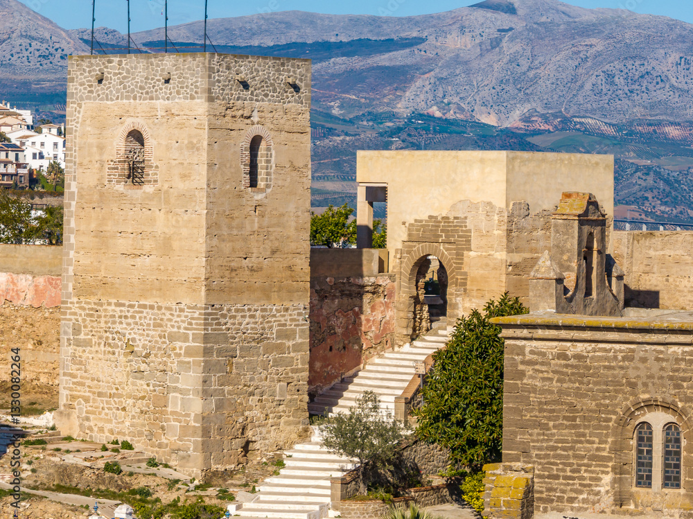 Close up aerial view of Alora hilltop castle with restored gate house and keep in Spain