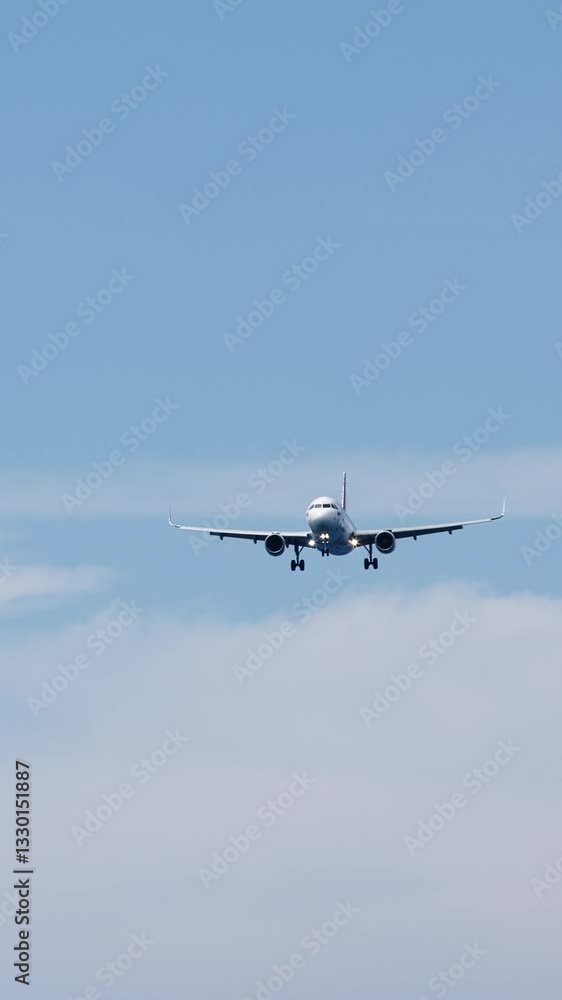 Vertical video. Airplane high in the cloudy sky. Travel and air travel concept. Vertical video. Airplane high in the cloudy sky. Travel and air travel concept.