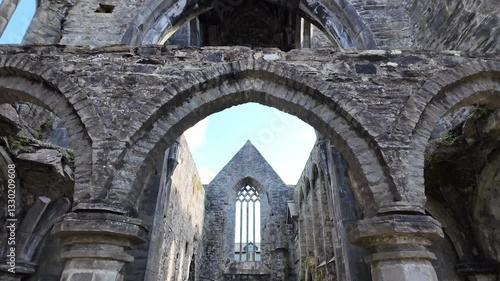 Wallpaper Mural Horizontal pan up of Sligo Abbey nave, Ireland, revealing stone arches, Gothic windows, and historic ruins Torontodigital.ca