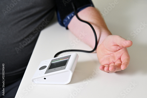 Man measuring blood pressure