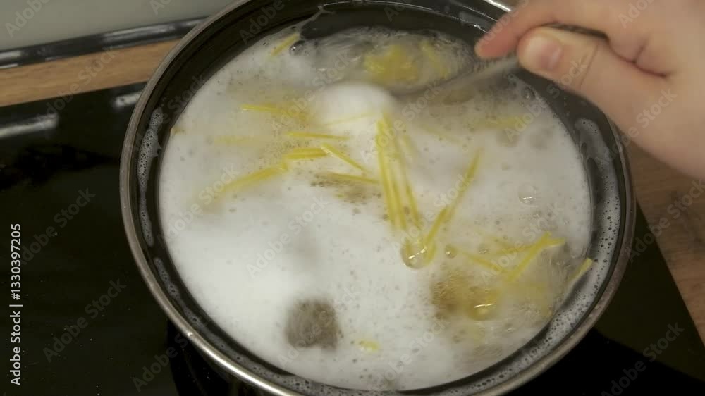 Delicious Pasta Boiling in a Pot, Generating Steam and Exciting, Bubbling Air Bubbles Delicious Pasta Boiling in a Pot, Generating Steam and Exciting, Bubbling Air Bubbles