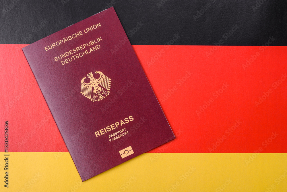 German citizen passport against the background of the German national flag German citizen passport against the background of the German national flag